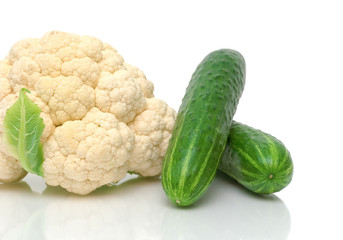 cauliflower and cucumbers close-up on white background