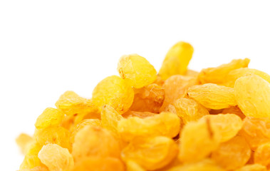 Golden raisins on a white background