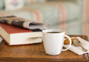 Black coffee in white mug wooden table