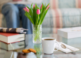 Black coffee in white mug glass topped table