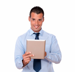 Handsome young businessman using his tablet pc