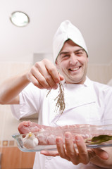 Chef in kitchen preparing food