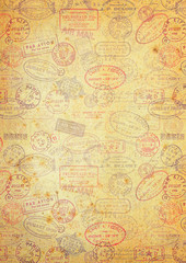 grungy paper background with vintage postage stamps