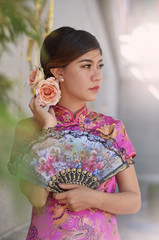 asian woman wearing a cheongsam