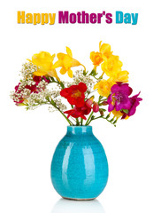 Beautiful bouquet of freesia in blue vase isolated on white
