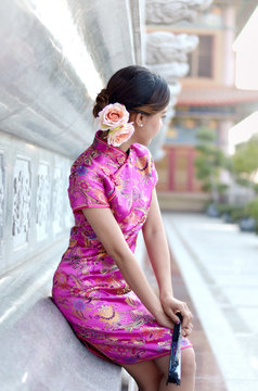 Asian Woman Wearing A Cheongsam, Chinese Costumes