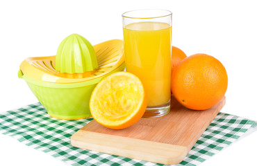 Citrus press and oranges isolated on white