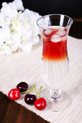 Glass of cocktail on table close-up