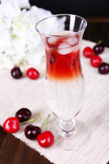 Glass of cocktail on table close-up