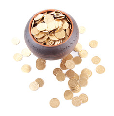 Golden coins in ceramic pot, isolated on white background
