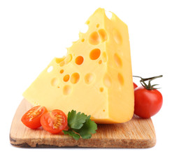 Piece of cheese and tomatoes, on wooden board, isolated on