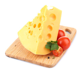 Piece of cheese and tomatoes, on wooden board, isolated on