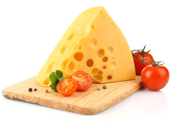 Piece of cheese and tomatoes, on wooden board, isolated on