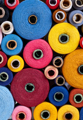 spools of thread of different size, texture and colour