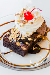 Chocolate brownie icecream and cherry
