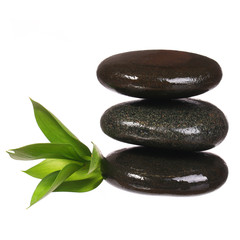 Spa Stones and Green Leaves isolated on white. Zen pebbles.