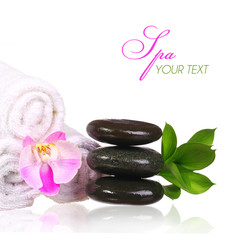 Spa setting. Spa Stones and Pink Orchid Flower with Green Leaves