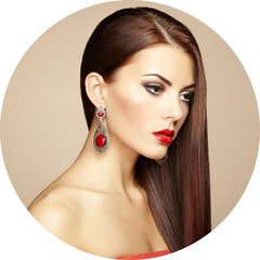 Fototapeta premium Portrait of beautiful brunette woman with earring. Perfect makeu