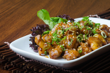 japanese cuisine. fry sauce chicken on the background