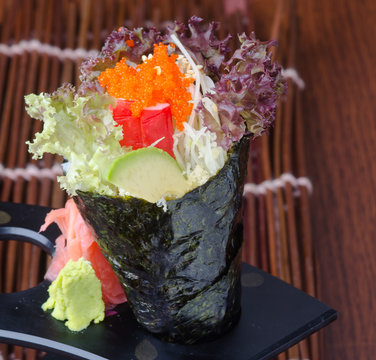 japanese cuisine. hand roll on the background