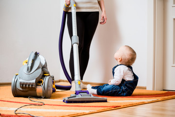 Cleaning home - mother and child
