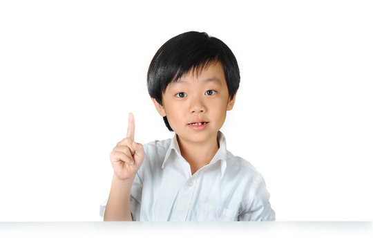 Asian schoolboy raising his index finger to speak