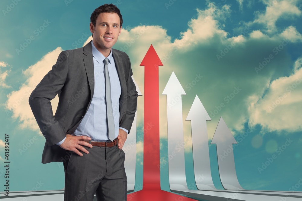 Poster Composite image of smiling businessman with hands on hips
