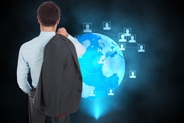 Composite image of businessman holding his jacket