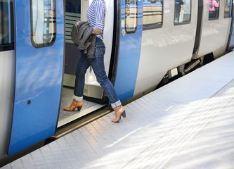 Woman enters train