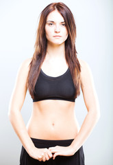 Obraz premium Attractive young athletic woman, sports bra