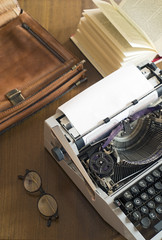 Typewriter and briefcases