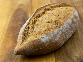Fresh bread on wooden table
