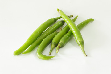green peppers on a white background