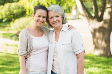 Portrait of a mature woman with daughter at park