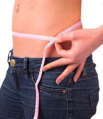 Diet concept. Woman measuring her waist, isolated 