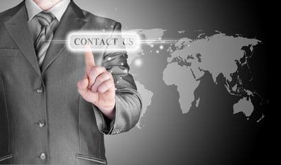 businessman hand pushing contact us button
