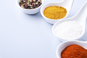 Various spices and herbs on white background