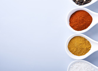 Various spices and herbs on white background