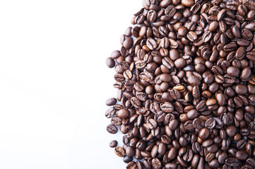 Roasted coffee beans pile from top on white background