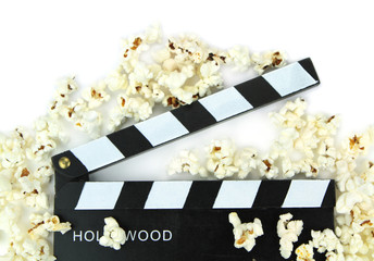 Popcorn and movie clapper , close up image