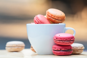 Macaron in coffee cup