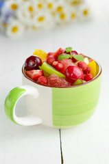 Green cup with fruits