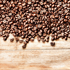 Roasted Coffee Beans background texture on wooden background fra