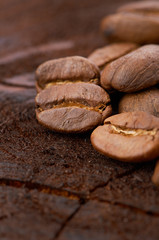 Coffee beans on wood background