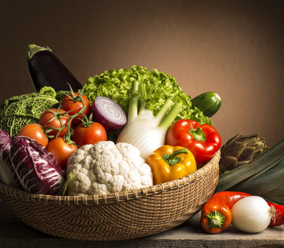 Fototapeta still life with vegetables isolated on brown background
