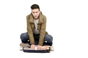 Tourist preparing his luggage for an adventure trip