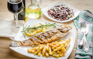 Baked seabass with fried potatoes
