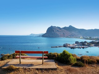 bench on a hill with sea ​​view