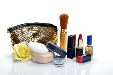Items for decorative cosmetics, makeup, mirror and flowers