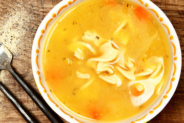 Canned Chicken Noodle Soup in Bowl on Table
